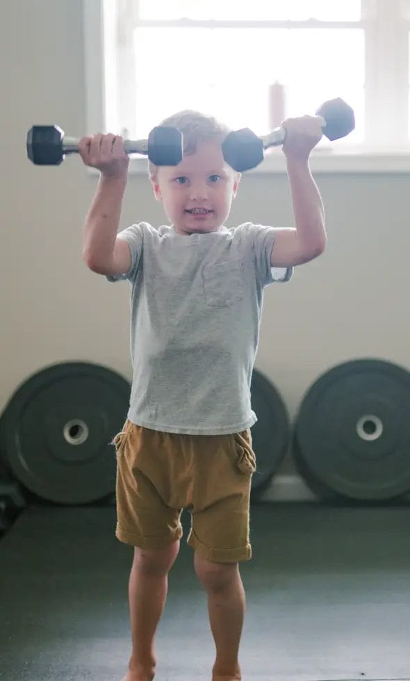 Kid doing fitness on a training